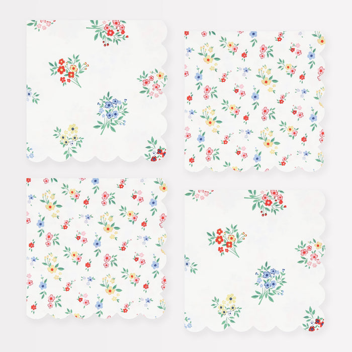 Ditsy Posy Scalloped Small Napkins with tiny multicolor floral prints, green leaves, and scalloped edges on a white background.