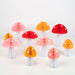 Honeycomb Mushroom Decorations with 10 dimensional paper mushrooms in assorted pink, red, coral, and orange caps with white stems and white spot details on a white background.