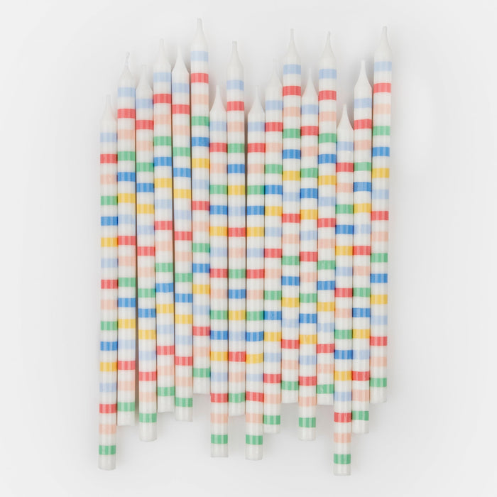 Multi Stripe Candles featuring tall white birthday candles with assorted red, blue, green, yellow, and peach horizontal stripes.