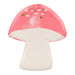 Fairy mushroom shaped plate with coral pink cap, cream stem, white spots, and small gold accents on a white background.