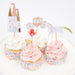 Princess cupcake kit with castle, carriage, horse, and flower toppers displayed on frosted cupcakes with floral cupcake liners.