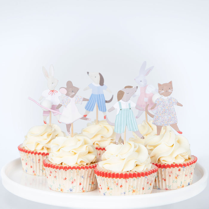 Animal Friends Cupcake Kit featuring illustrated animal character toppers and coordinated cupcake liners arranged on frosted cupcakes.
