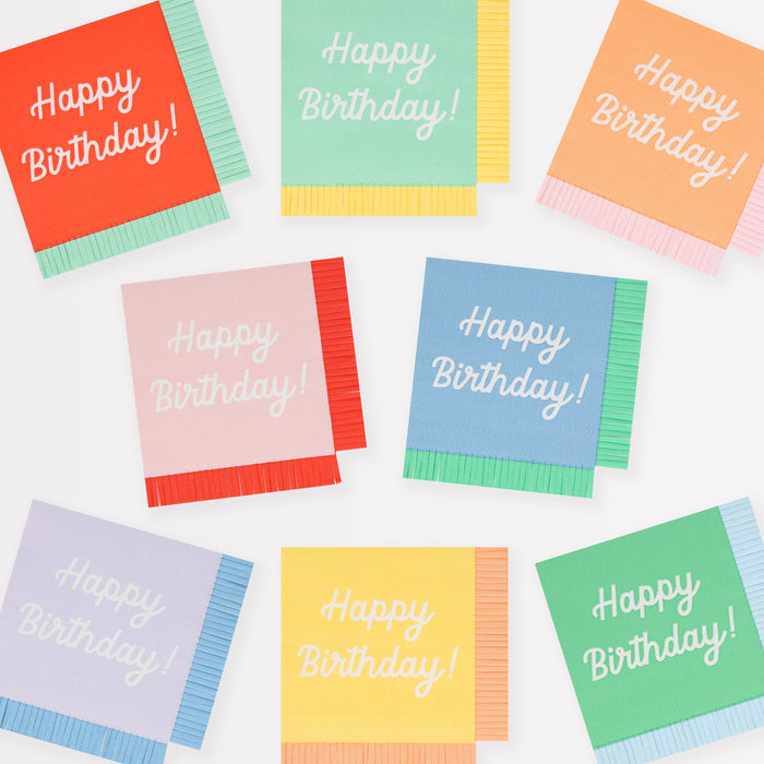 Mixed Happy Birthday small napkins in assorted bright colors with white birthday lettering and contrasting fringe-style edges.