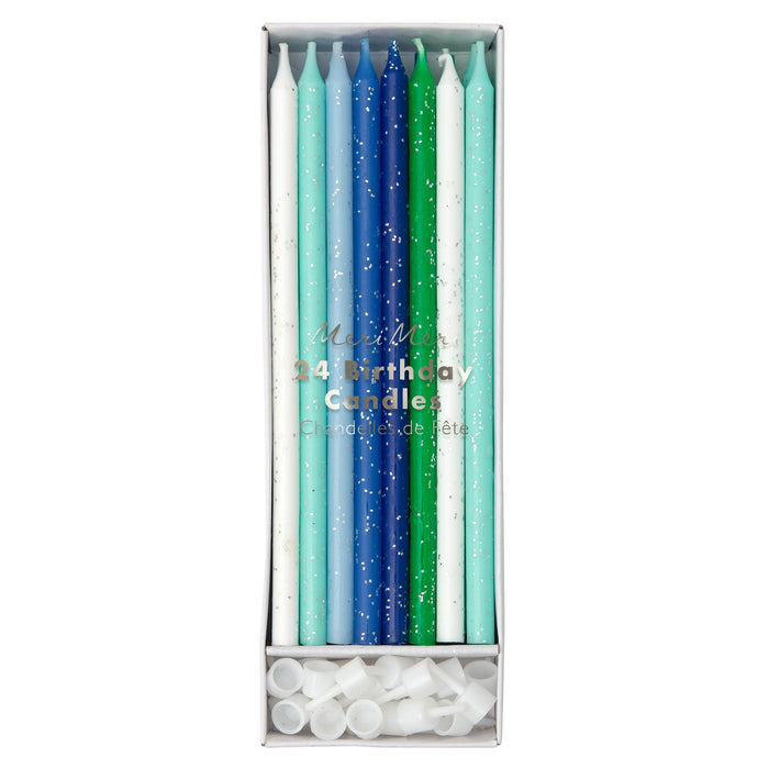 Blue, white, and green glitter birthday candles in a 24-count box with silver sparkle accents and white candle holders.

