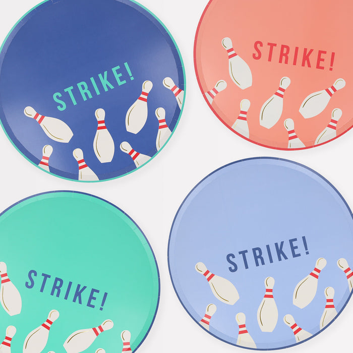 Bowling Dinner Plates in assorted colors with bowling pin illustrations and bold “Strike!” lettering.
