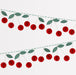 Cherry honeycomb garland with red honeycomb cherries, green paper leaves, and hanging twine.