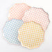 Gingham Dinner Plates in assorted pastel pink, blue, coral, and yellow checkered patterns with scalloped edges on a white background.