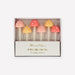 Mushroom Birthday Candles in clear packaging with 6 mushroom-shaped candles in coral, peach, and yellow with white polka dots.