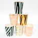 Safari animal print party cups with zebra, tiger, leopard, and giraffe patterns stacked together with shiny gold rim accents.