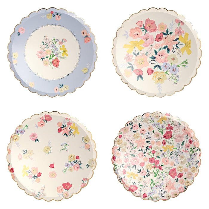 English Garden Dinner Plates with assorted pastel floral designs and scalloped gold edges on a white background.