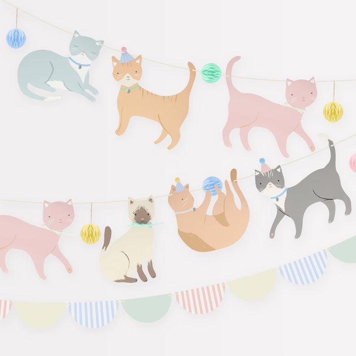 Cute Kittens Garland Set with pastel illustrated cat cutouts, honeycomb ball accents, party hat details, and scalloped bunting on a white background.