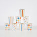 Colorful Pattern Cups arranged in a pyramid with assorted striped, polka dot, and checkered designs in bright multicolor shades with gold rims.