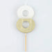White number 8 cake candle with metallic gold dipped finish and wooden pick on a white background.
