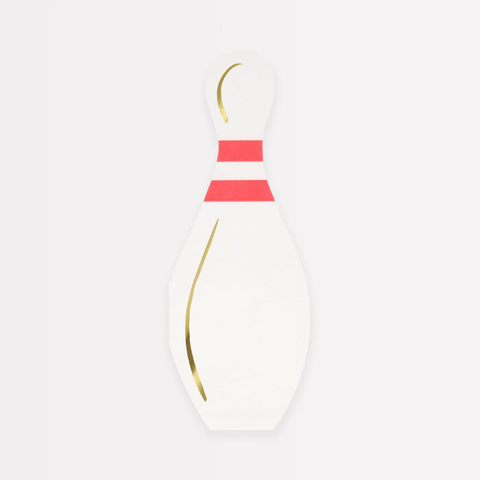 Bowling pin-shaped napkins with red stripe details and gold accents.