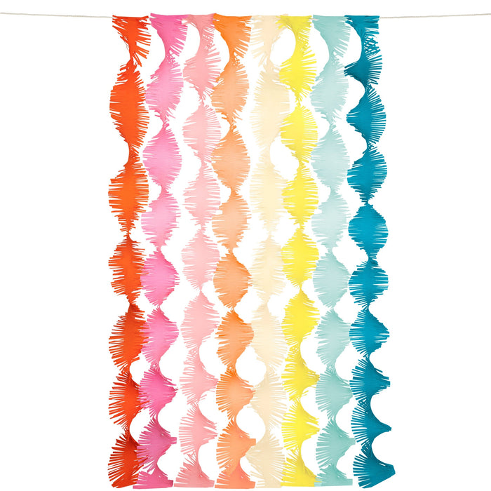 Rainbow Twisty Fringe Backdrop with long hanging fringe streamers in red, pink, orange, cream, yellow, mint, and teal on a white background.