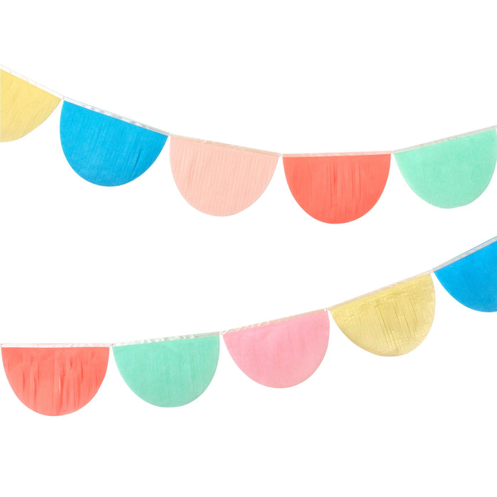 Rainbow Tissue Paper Scallop Garlands with colorful half-circle tissue paper pieces strung on two hanging garlands.