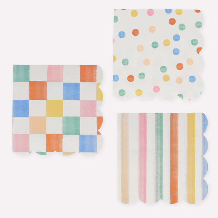 Colorful Pattern Small Napkins with checkerboard, polka dot, and stripe designs in pastel multicolor shades with scalloped edges on a white background.