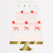 Fancy Cake Plate shaped like a tiered pink cake with candles, cherries, red bows, blue garland accents, and a gold cake stand.
