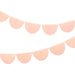 Peach Tissue Paper Scallop Garland Set with pale peach semicircle tissue garlands hanging on a white background.