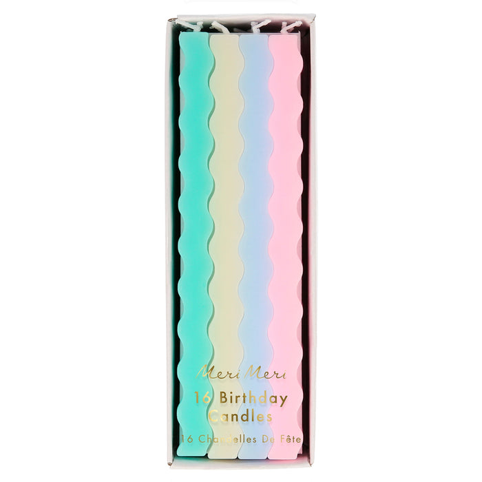 Pastel Wavy Candles in clear packaging with long wavy birthday candles in mint, cream, light blue, and pink.