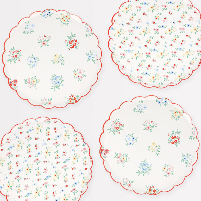 Ditsy Posy Scalloped Side Plates with delicate floral details and scalloped edges for a garden party table setting.