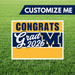 Graduation-themed customizable sign with 'Congrats Grad 2026' text on a grass background