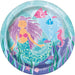 Round turquoise paper plate featuring an illustrated mermaid with purple hair surrounded by colorful fish, seahorses, seaweed, and bubbles in an underwater scene.