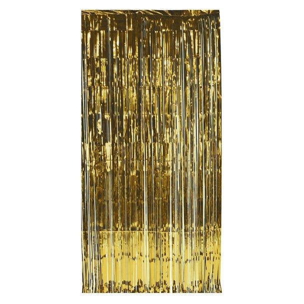 Gold metallic foil fringe curtain with long hanging strands creating a shimmering doorway backdrop.