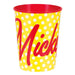 Yellow plastic cup with white polka dots, red interior rim, and large red cursive text reading "Minnie" on the front.