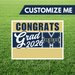 Graduation-themed customizable sign with 'Congrats Grad 2026' text on a grass background