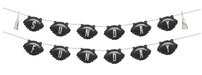Two rows of black scalloped balloon banners spelling "SUNDAY" and "FUNDAY" in white letters, strung on twine with silver tassel clips at each end.