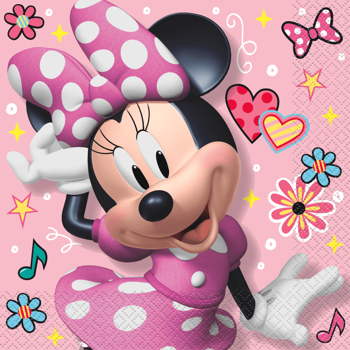 Minnie Mouse depicted in a pink polka-dot dress with large bow on a bright pink background surrounded by colorful flowers, hearts, stars, and musical notes.