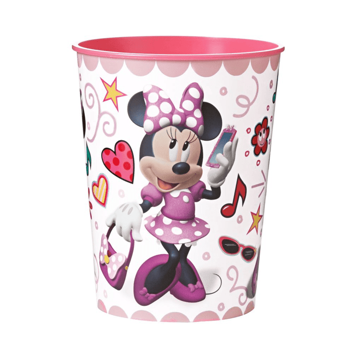 Pink and white plastic cup featuring Minnie Mouse in a purple polka dot dress surrounded by hearts, stars, musical notes, and sunglasses with a scalloped pink rim.