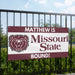 Banner with Missouri State University logo and text on a fence