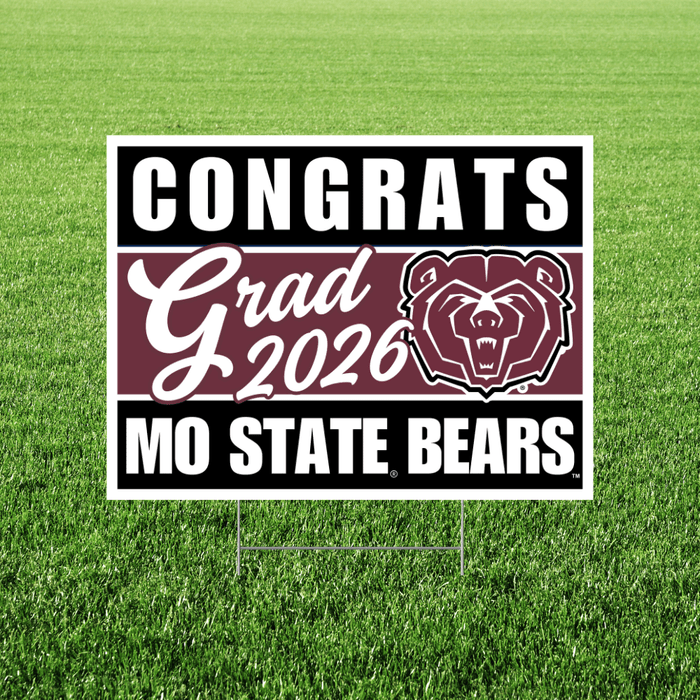 White yard sign with black and maroon sections displaying "CONGRATS Grad 2026" text and Missouri State Bears logo on green grass.