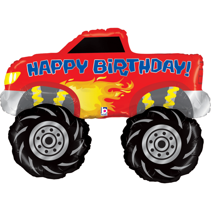Red monster truck-shaped foil balloon with "Happy Birthday" text, large black tires with gray wheel hubs, yellow flame design, and headlights on white front section.