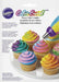Wilton Color Swirl three-hole frosting coupler packaging showing colorful decorated cupcakes with swirled purple, pink, yellow, and teal frosting.