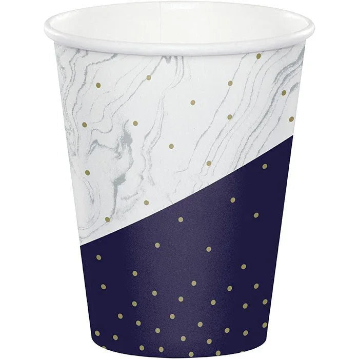 White paper cup with gray marble pattern on upper half, navy blue section on lower half, and scattered gold dots throughout, shown against plain background.