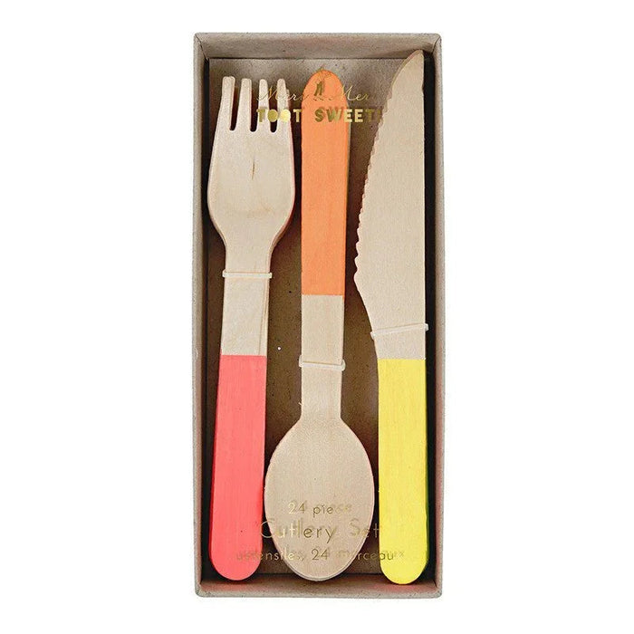 Three wooden utensils with neon-colored handles in coral, orange, and yellow arranged in a tan cardboard box.