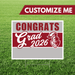 Graduation-themed customizable sign with 'Congrats Grad 2026' text on a grass background