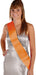 Woman wearing a silver halter dress with a bright orange satin sash draped diagonally across the torso, featuring a decorative silver buckle at the waist.
