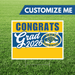 Graduation-themed sign with 'Congrats Grad 2026' text and Orem High School logo on a grass background.