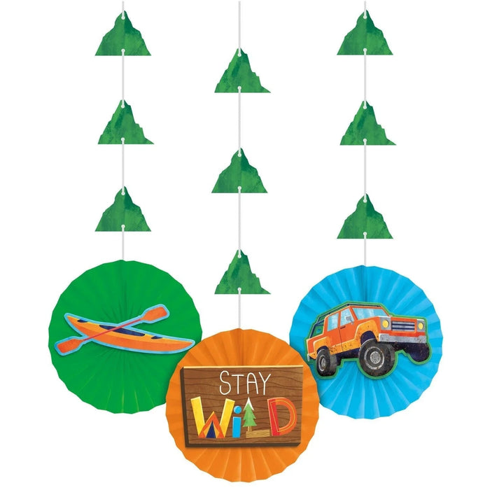 Set of three colorful paper hanging decorations featuring a kayak on green, "Stay Wild" sign on orange, and a truck on blue, with nine small green tree ornaments suspended above on string.