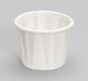 White pleated paper portion cup with ridged sides shown from a front angle against a gray background.