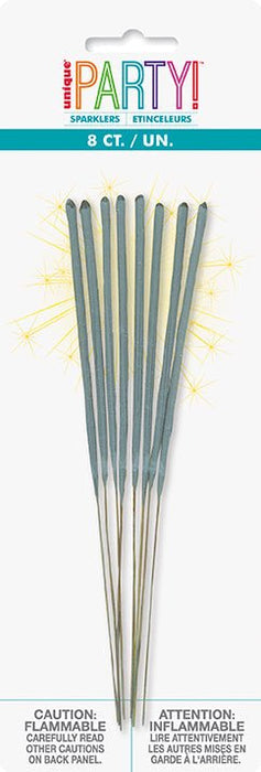 Package of 8 sparkler sticks with gray handles and white tips, displayed fanned out with gold sparkle effects illustrated around them.