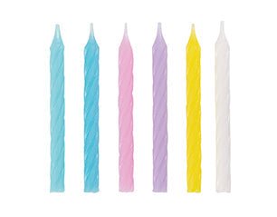 Six tall spiral candles in pastel colors including light blue, pink, purple, yellow, and white arranged in a row.