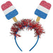 Pair of sparkly headbands with red, white, and blue popsicle-shaped toppers featuring tinsel pom-poms in patriotic colors.
