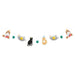 Colorful paper garland banner featuring alternating cute cat and kitten illustrations in gray bowls, green honeycomb balls, and orange paw-print decorated bells arranged in a horizontal line.