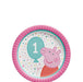 Pink paper dessert plate featuring Peppa Pig with a turquoise balloon displaying the number 1, surrounded by colorful confetti on a white background with a pleated pink rim.