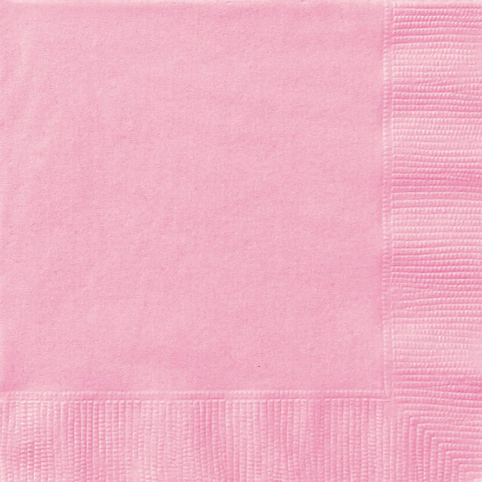Pink paper napkins with a textured quilted pattern on the edges, showing the characteristic fold lines and material weave of disposable party napkins.